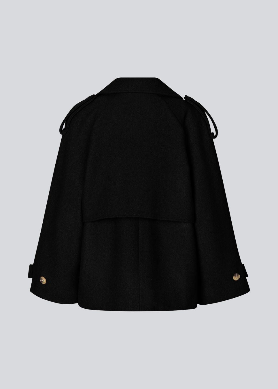 Cropped dobbeltradet uldfrakke med skjulte knapper. EsmundMD jacket har klassiske frakkedetaljer med raglanærmer og bredt bærestykke på ryggen. Med foer. Modellen er 175 cm og har en størrelse S/36 på.