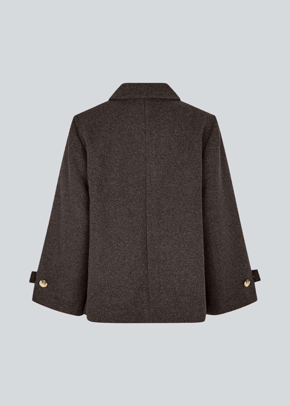 Klassisk kort jakke i uldblanding. Ofiamd jacket har en afslappet pasform, skjult knappelukning og krave. Modellen er 175 cm og har en str. s/36 på.