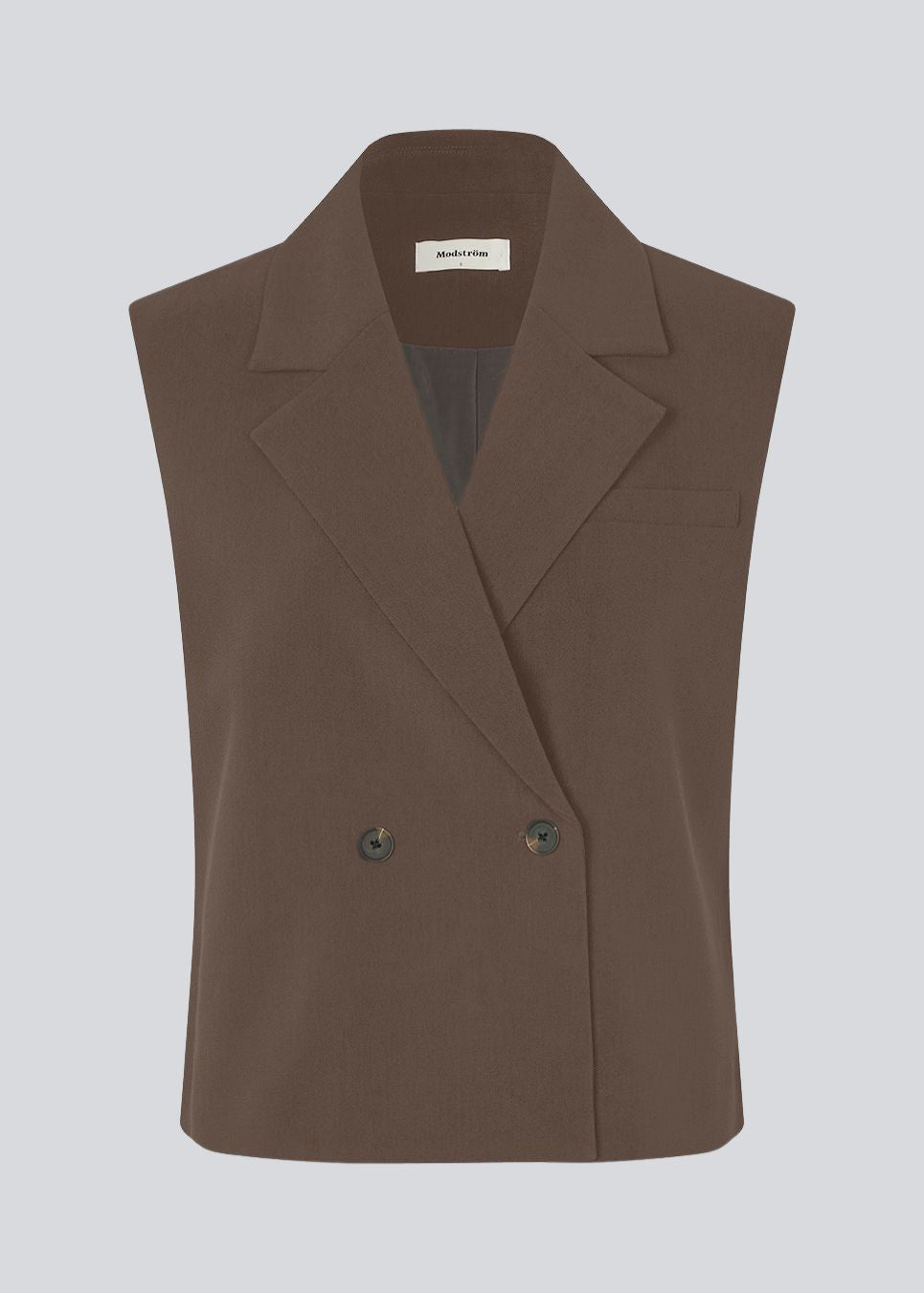 Løs vest med krave i vores klassiske gale materiale. Galemd vest er ærmeløs og har en knappelukning fortil.