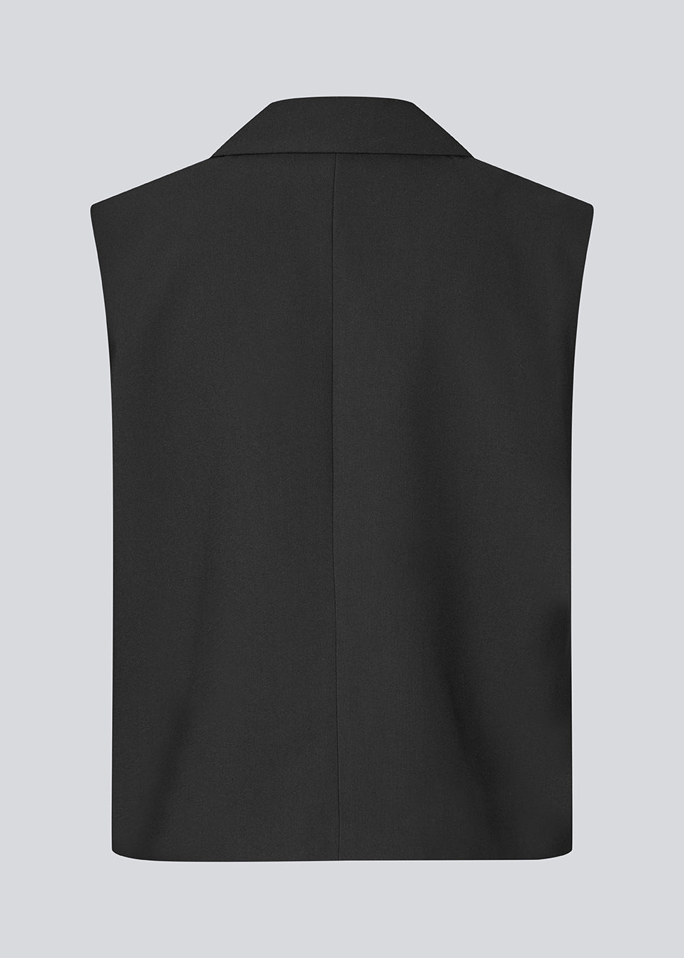 Løs vest med krave i vores klassiske gale materiale. Galemd vest er ærmeløs og har en knappelukning fortil. Modellen er 175 cm og har en str. S/36 på.