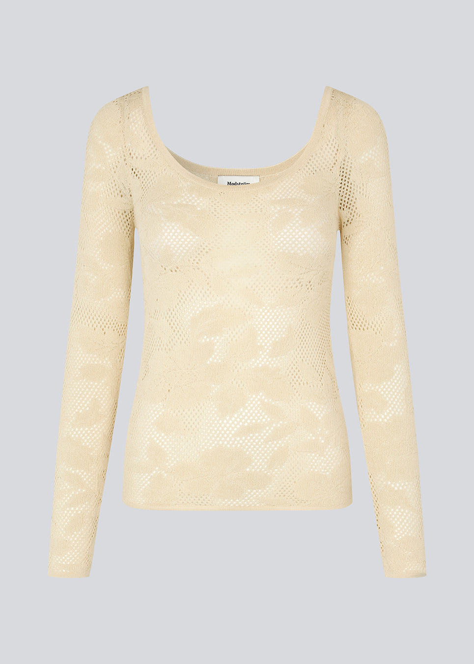 Tætsiddende top i beige i stretchy blonde, der er en smule gennemsigtig. HawkinsMD top har lange ærmer og en dyb udskæring både foran og bagved.