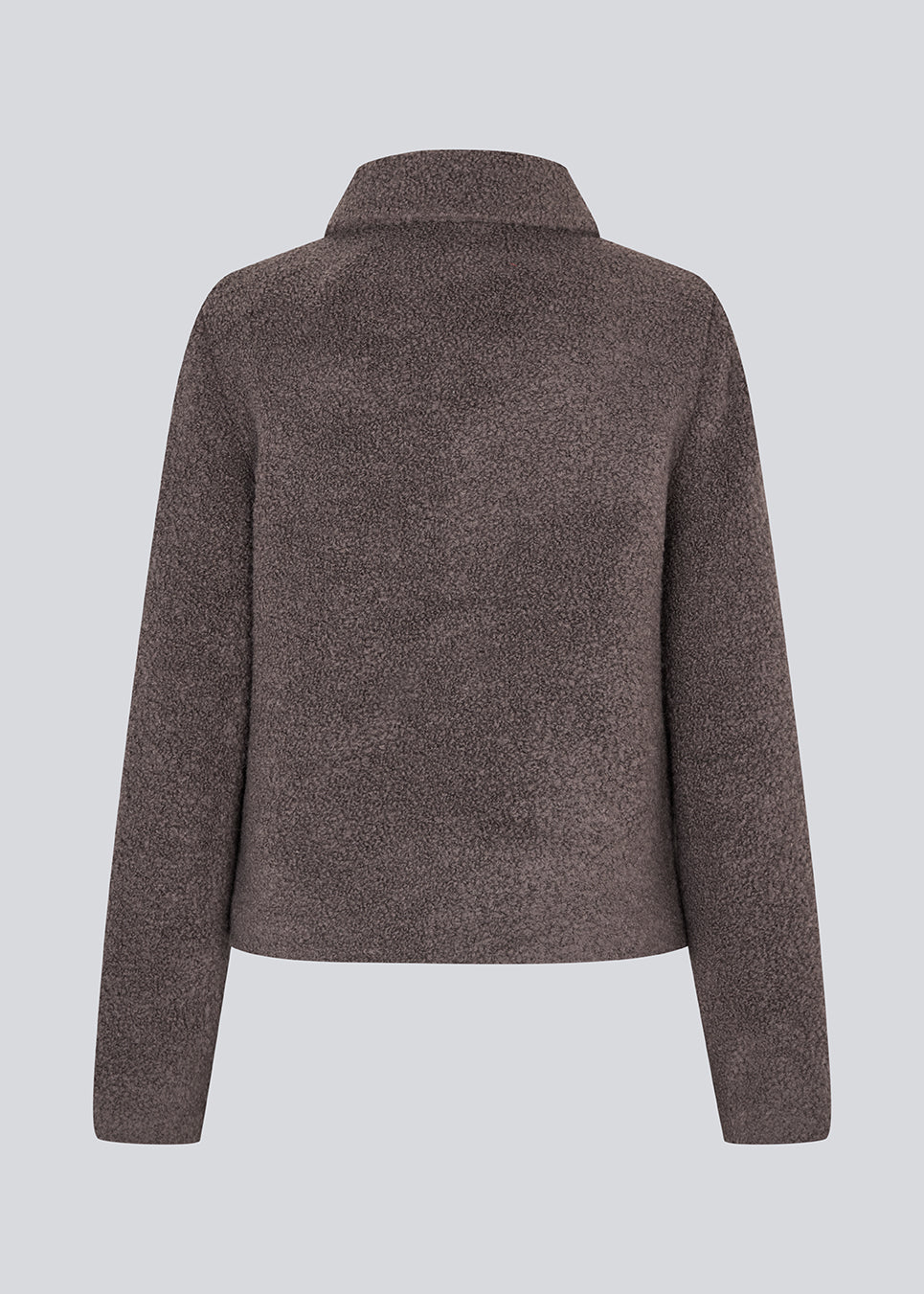 Kort jakke i uldblanding. JustyMD short jacket har en løs pasform, knappelukning og to lommer fortil.