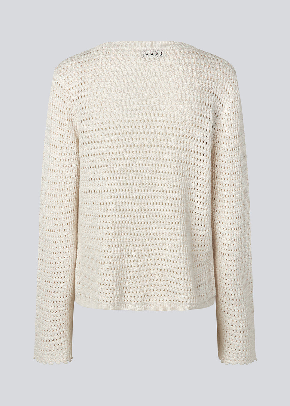 Hæklet top i økologisk bomuld. MieMD top har detaljerede kanter og lange brede ærmer.