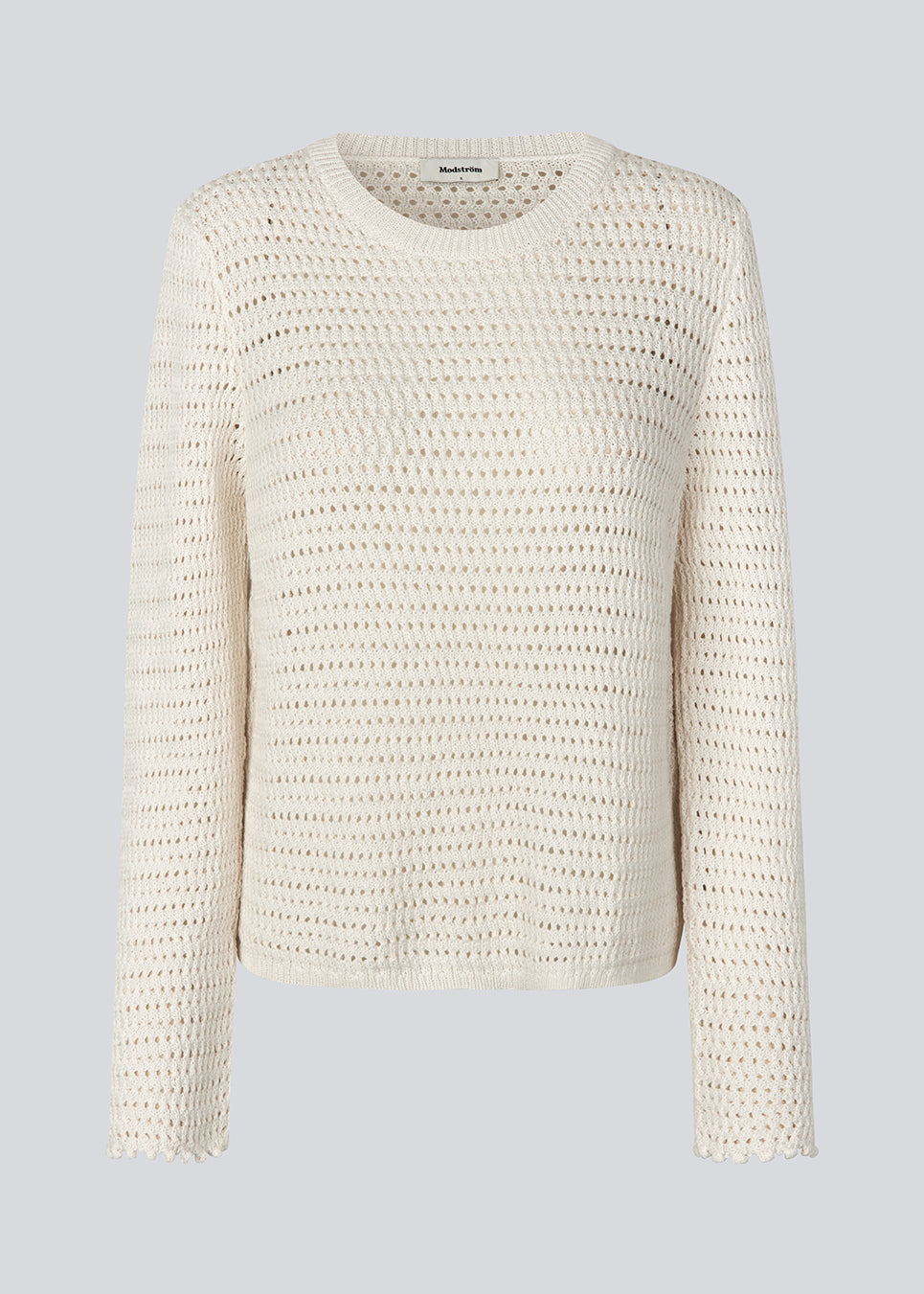 Hæklet top i økologisk bomuld. MieMD top har detaljerede kanter og lange brede ærmer.