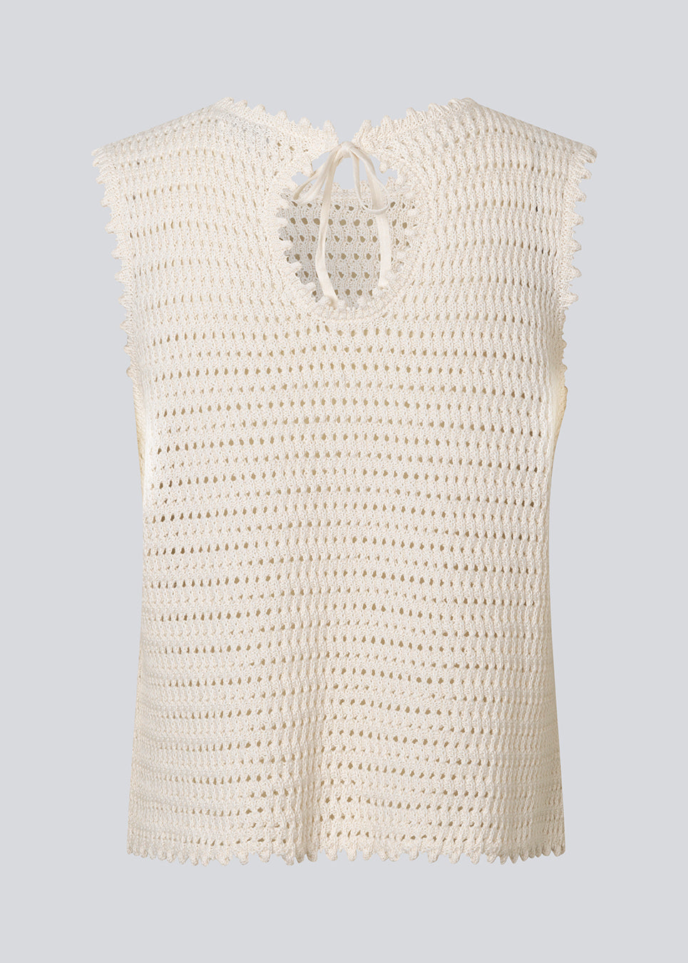 Hæklet top uden ærmer i økologisk bomuld. MieMD top har detaljerede kanter og en dyb rygudskæring.