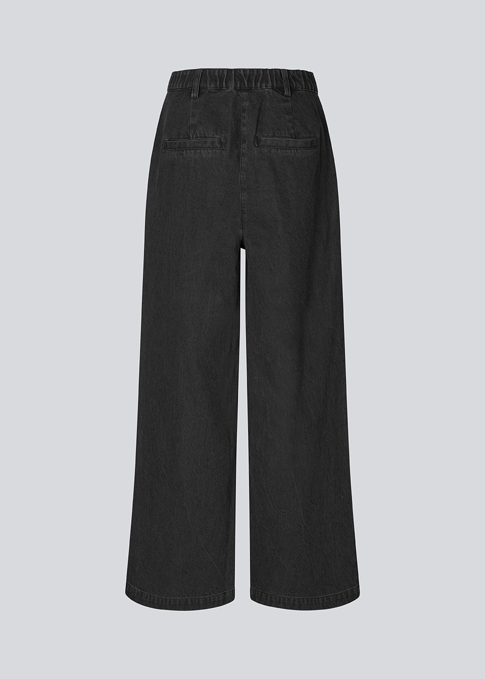 Habitbukser i denim med vide ben. MinniMD pants har en mellemhøj talje, lynlåsgylp og læg foroven, samt sidelommer og paspolerede baglommer.