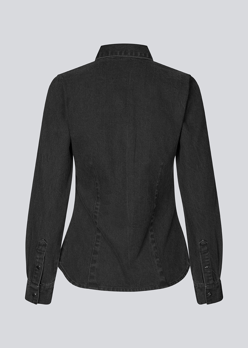 Blød denim skjorte i 100% bomuldsdenim. MinniMD shirt er figursyet og har en knappelukning fortil og skjortekrave.