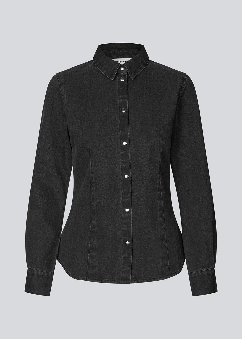 Blød denim skjorte i 100% bomuldsdenim. MinniMD shirt er figursyet og har en knappelukning fortil og skjortekrave.