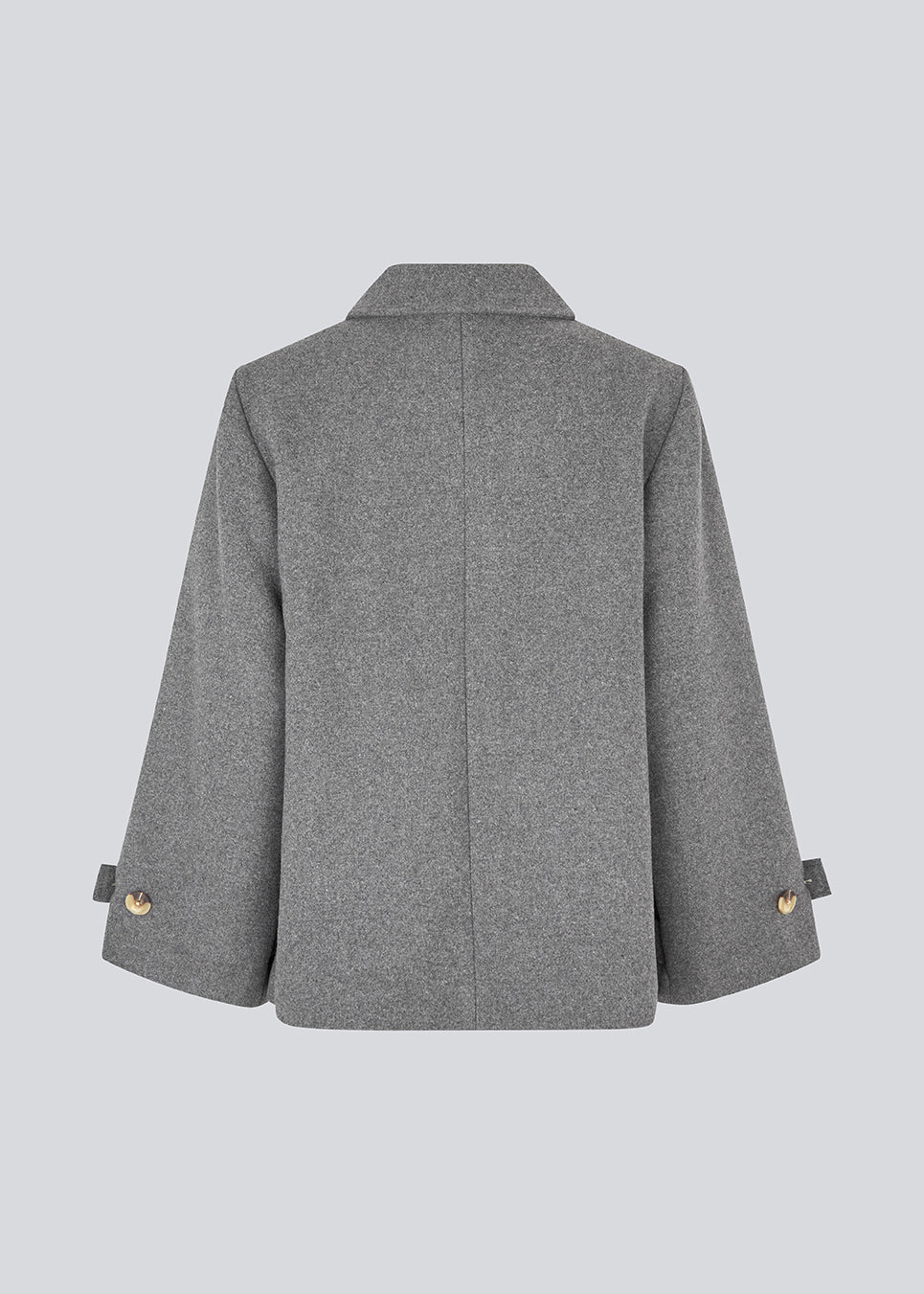 Klassisk kort jakke i uldblanding. Ofiamd jacket har en afslappet pasform, skjult knappelukning og krave. Modellen er 175 cm og har en str. s/36 på.