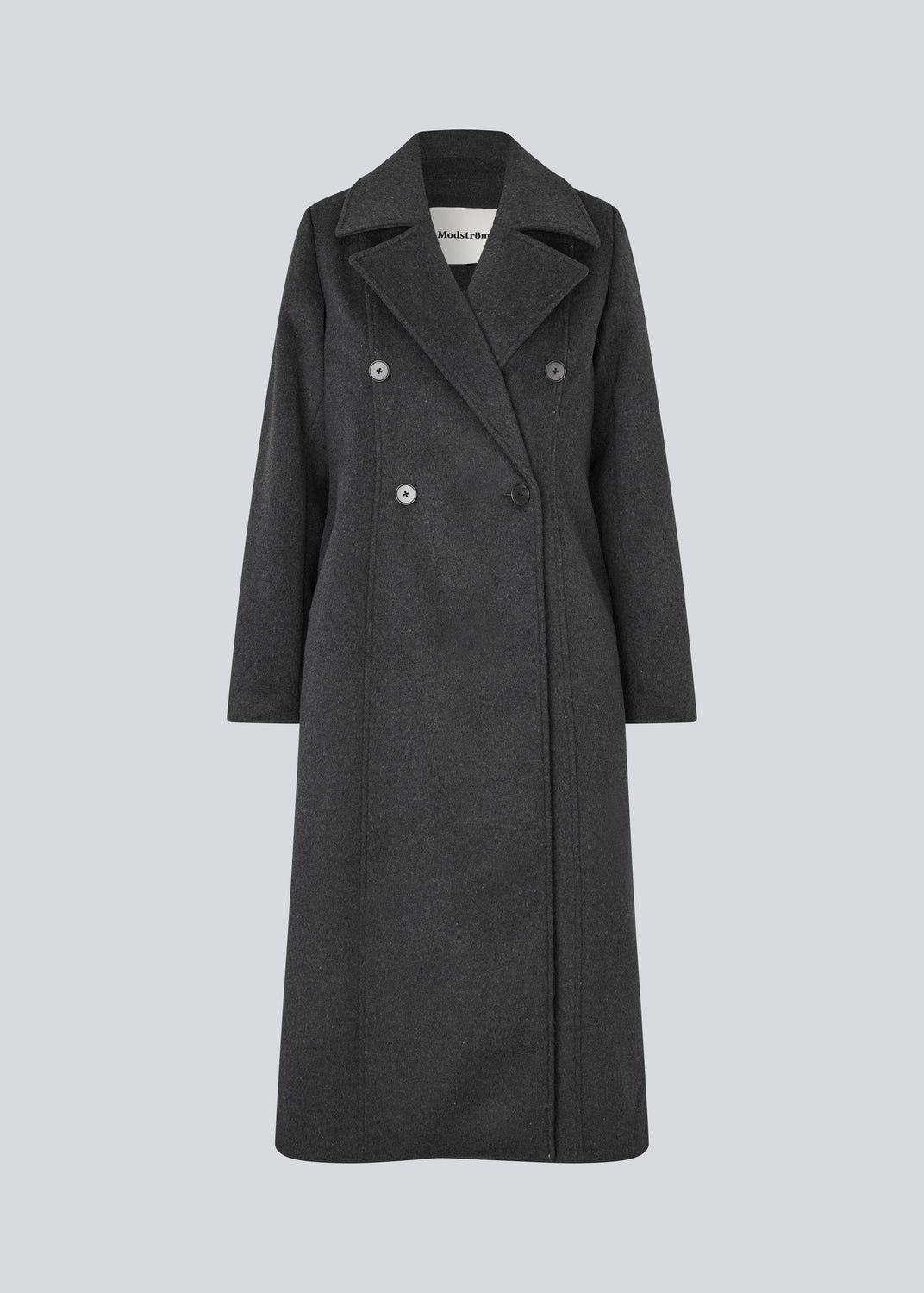 Klassisk, dobbeltradet uldfrakke med krave og revers. Olinamd coat er let figursyet, har foer og en slids bagpå. Modellen er 175 cm og har en str. s/36 på.