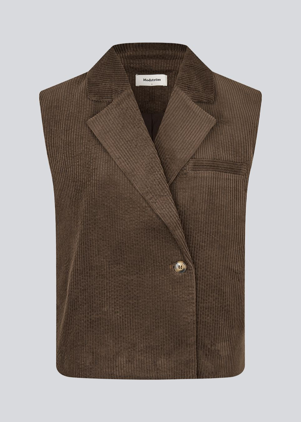 Stilren vest i blød fløjl. Roycemd vest har en moderne asymmetrisk lukning og en enkelt brystlomme. Et alsidigt lag-på-lag item, der er nem at style.