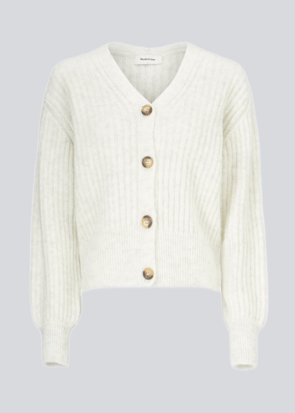 Blød, kort cardigan i uldmix. Goldie cardigan har struktur og knaplukning fortil.
