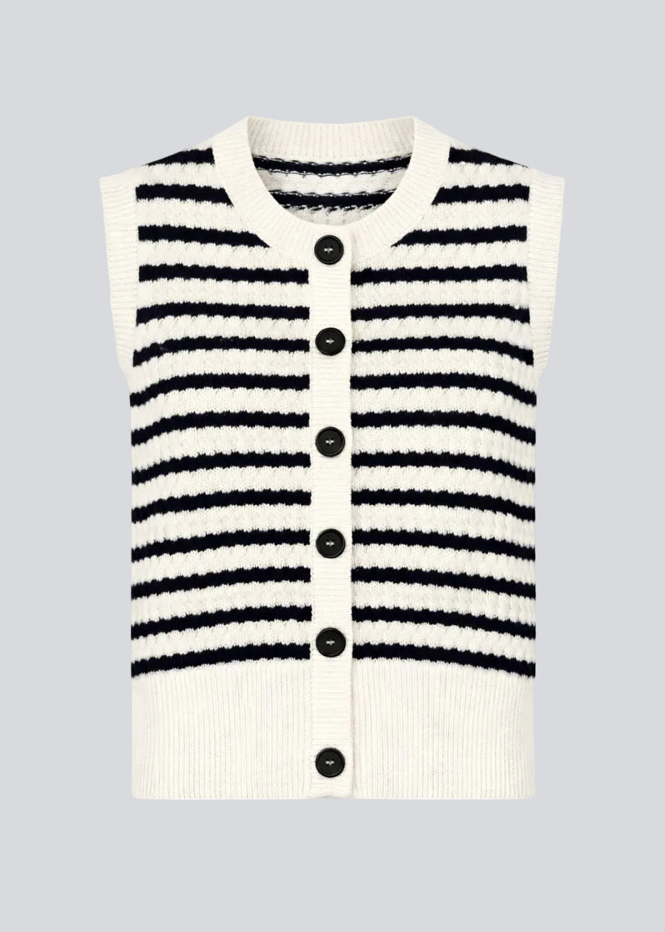 Strikket vest i navy og hvid med rund hals og knaplukning foran. Ulvamd stripe top har et klassisk stribet mønster og brede ribkanter, der giver en flot pasform. Fremstillet i 100% økologisk bomuld – perfekt til lag-på-lag styling.&nbsp;