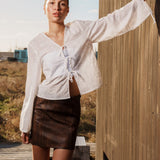 Klassisk kort a-formet nederdel i Lammelæder med mellemhøj talje. IsmaelMD skirt har et vintage-inspireret look og en skjult lynlås i siden.