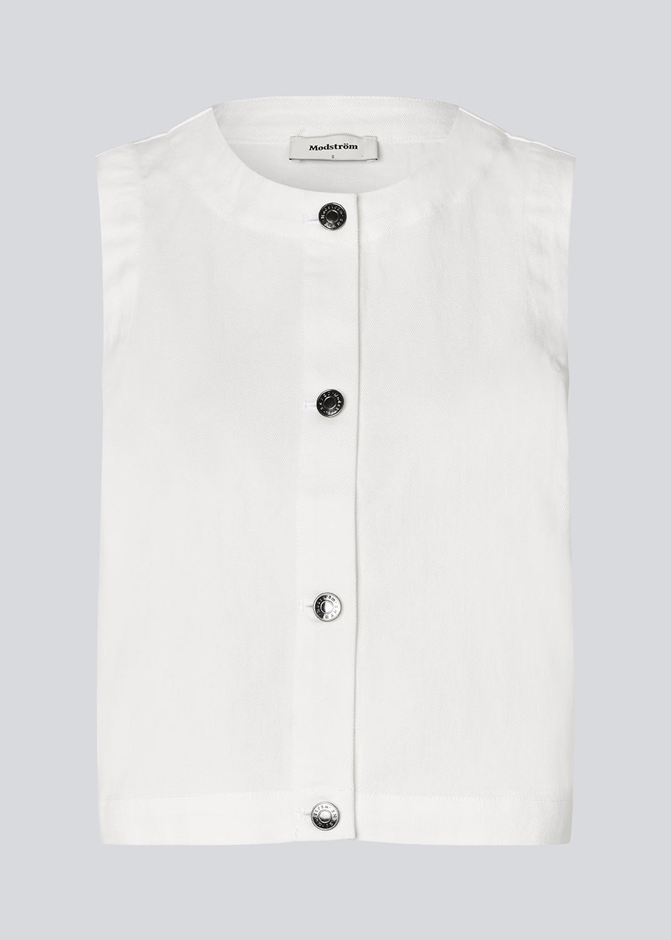 Ærmeløs denimtop med sølvknapper. AggiMD Solid Top har et løst snit med rund halsudskæring. En moderne og afslappet top, der kombinerer klassisk denim med stilfulde detaljer.