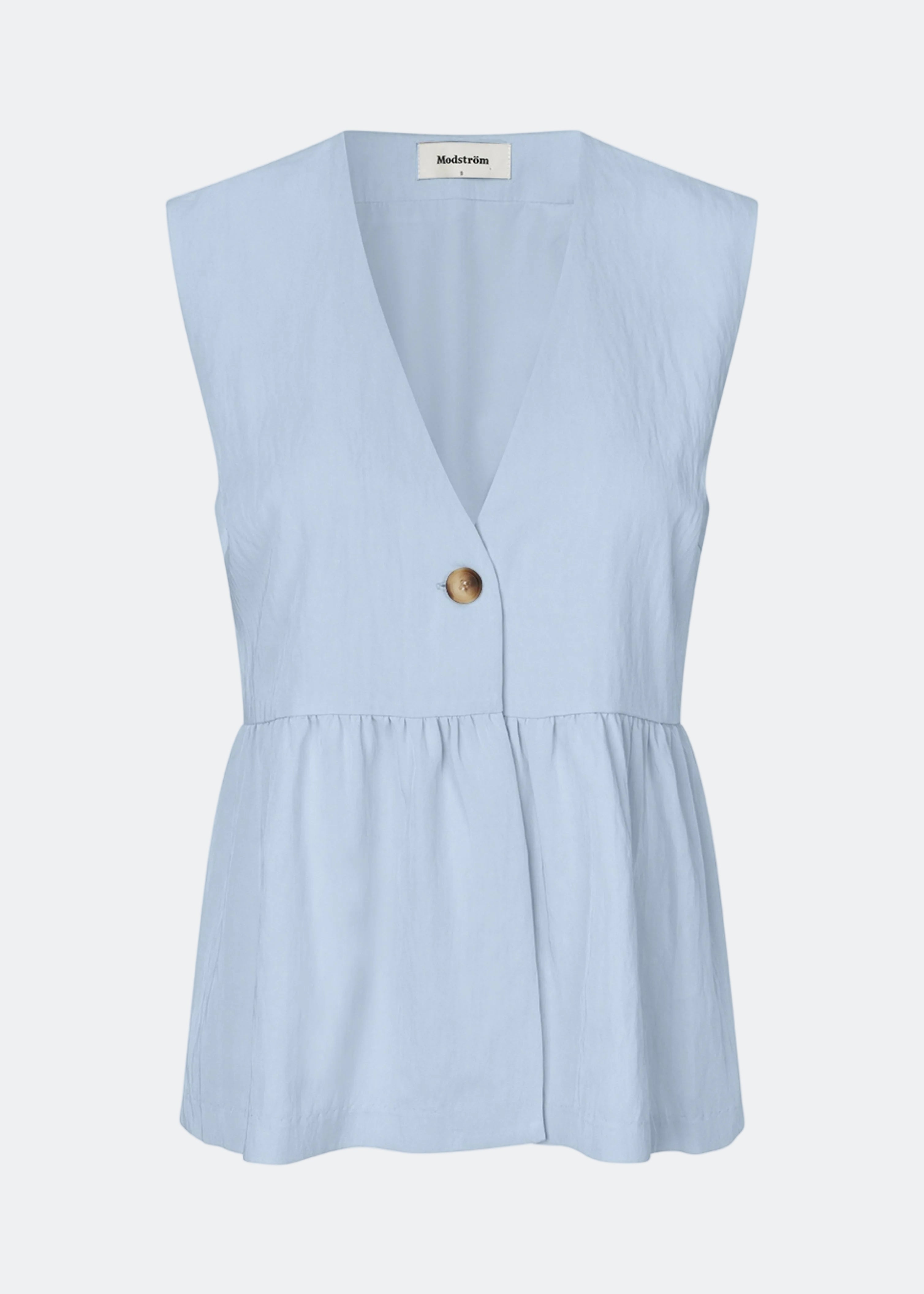 Feminin vest-top med rynket, løs bund. AgneteMD Vest er ærmeløs med V-udskæring og enkel knaplukning. Kan styles alene eller lag-på-lag for et moderne og alsidigt look.