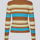 Langærmet cardigan med polokrave og striber. AslanMD Cardigan er designet i ribstrik i 100% økologisk bomuld med elastik, der giver et tætsiddende og komfortabelt fit. Perfekt til lag-på-lag styling eller som en elegant hverdagsfavorit.