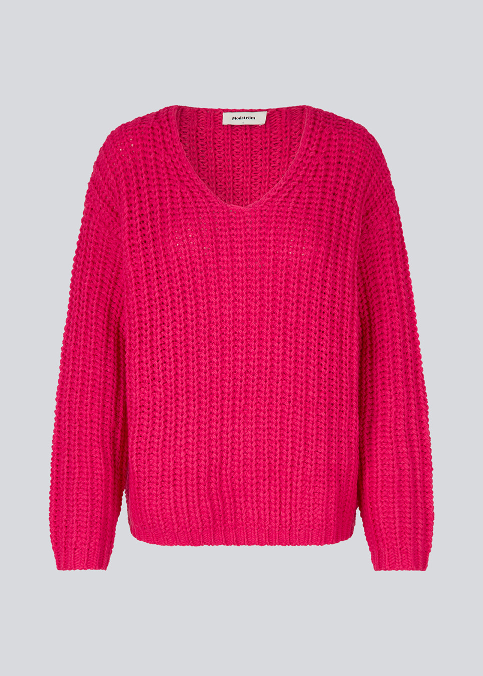 Chunky striktrøje i pink med afslappet pasform. FelipeMD v-neck har v-udskæring, lange ærmer og ribkanter forneden på krop og ærmer. 