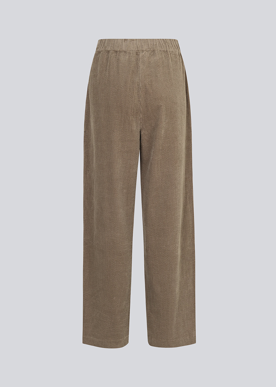 Fløjlsbukser i beige med lange, brede ben og høj talje med lynlåsgylp og knap samt elastik bagpå. FikaMD pants er med foer. 