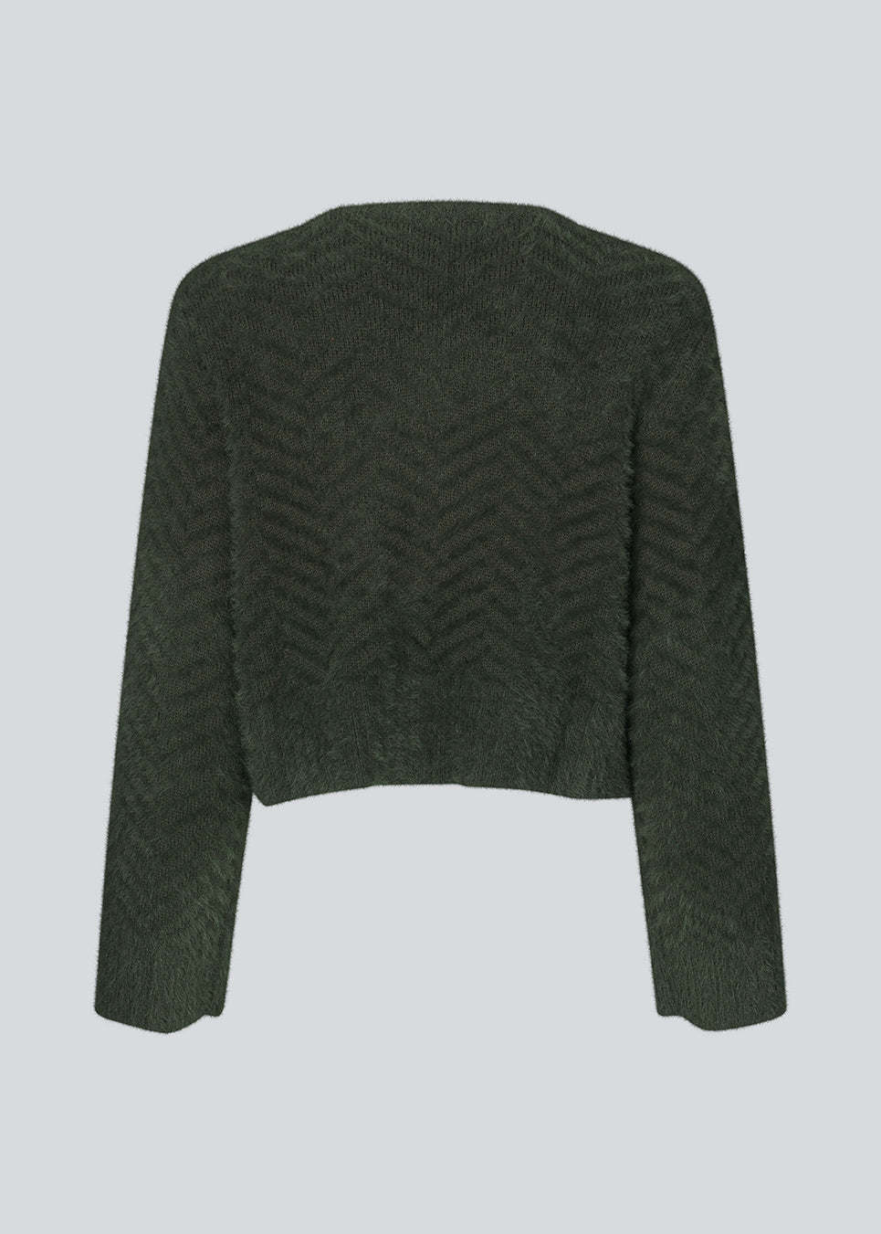 Lodden cardigan i bomuldsblanding i mørkegrøn. FloriaMD cardigan har en afkortet form, v-udskæring, lange brede ærmer og knaplukning fortil. Modellen er 175 cm og har en størrelse S/36 på.
