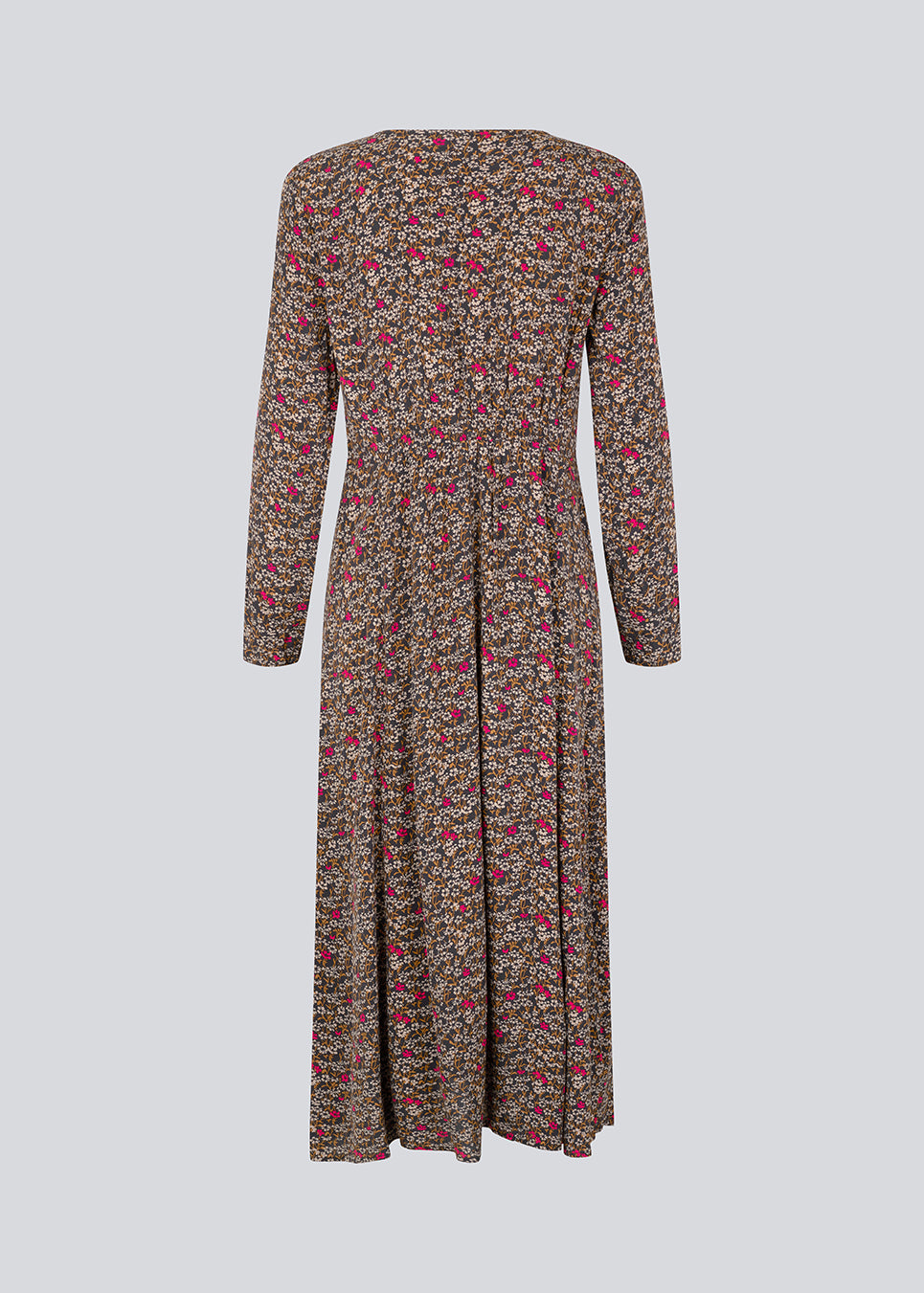 Lang kjole i let, vævet EcoVero viskose med print. FloryMD print dress har en smal pasform med v-udskæring, lange ærmer, smock-detalje under bryst og på ryggen samt høj slids foran. Modellen er 175 cm og har en størrelse S/36 på.