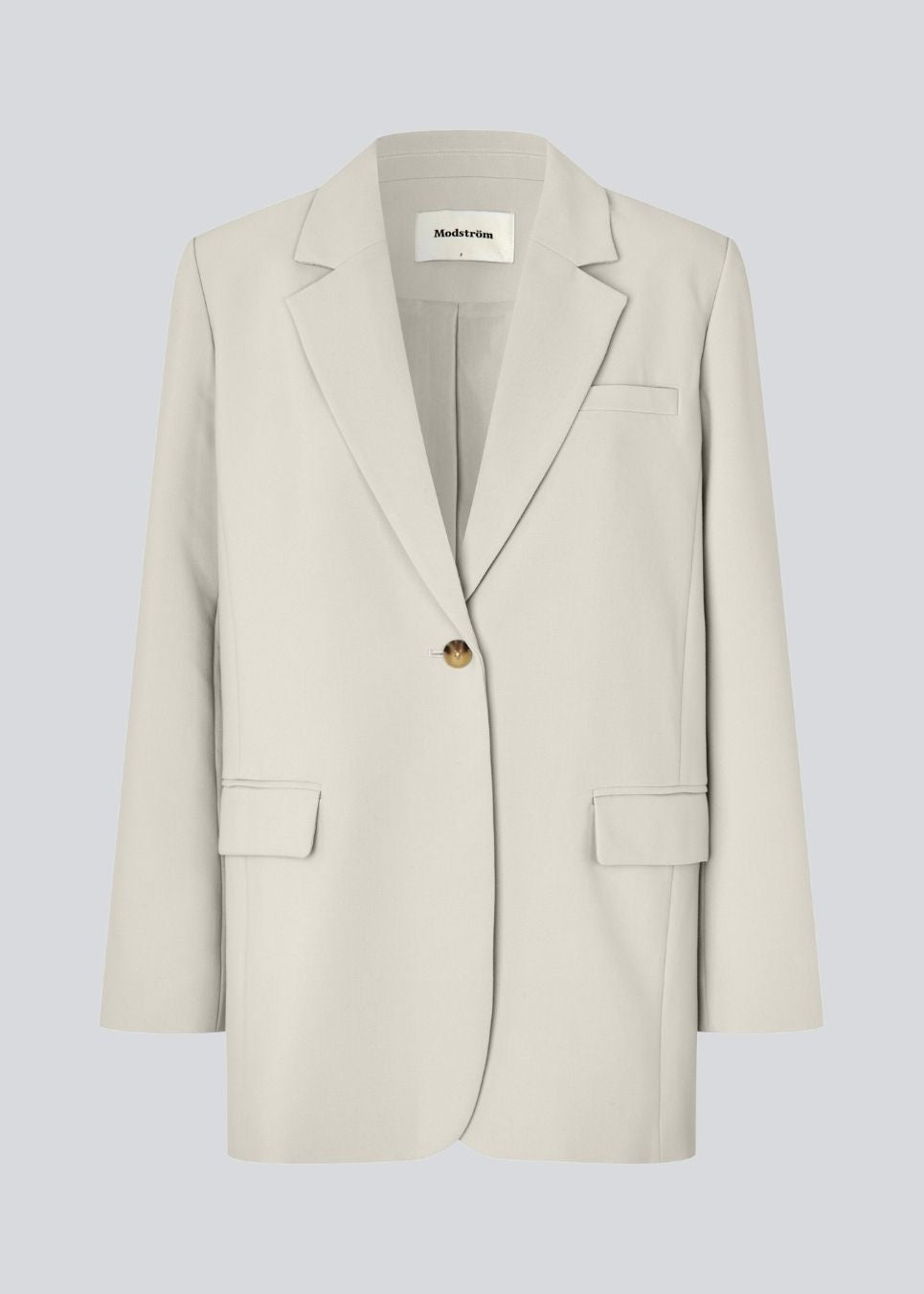 Gale blazer i beige har et klassisk og elegant design, som kommer til udtryk i den flotte reverskrave og den lange pasform. Blazeren har knaplukning fortil og en brystlomme i venstre side.

Materiale:
5% Elastan
76% Recycled Polyester
19% Viskose

Foer:
35% Polyester
65% Viskose