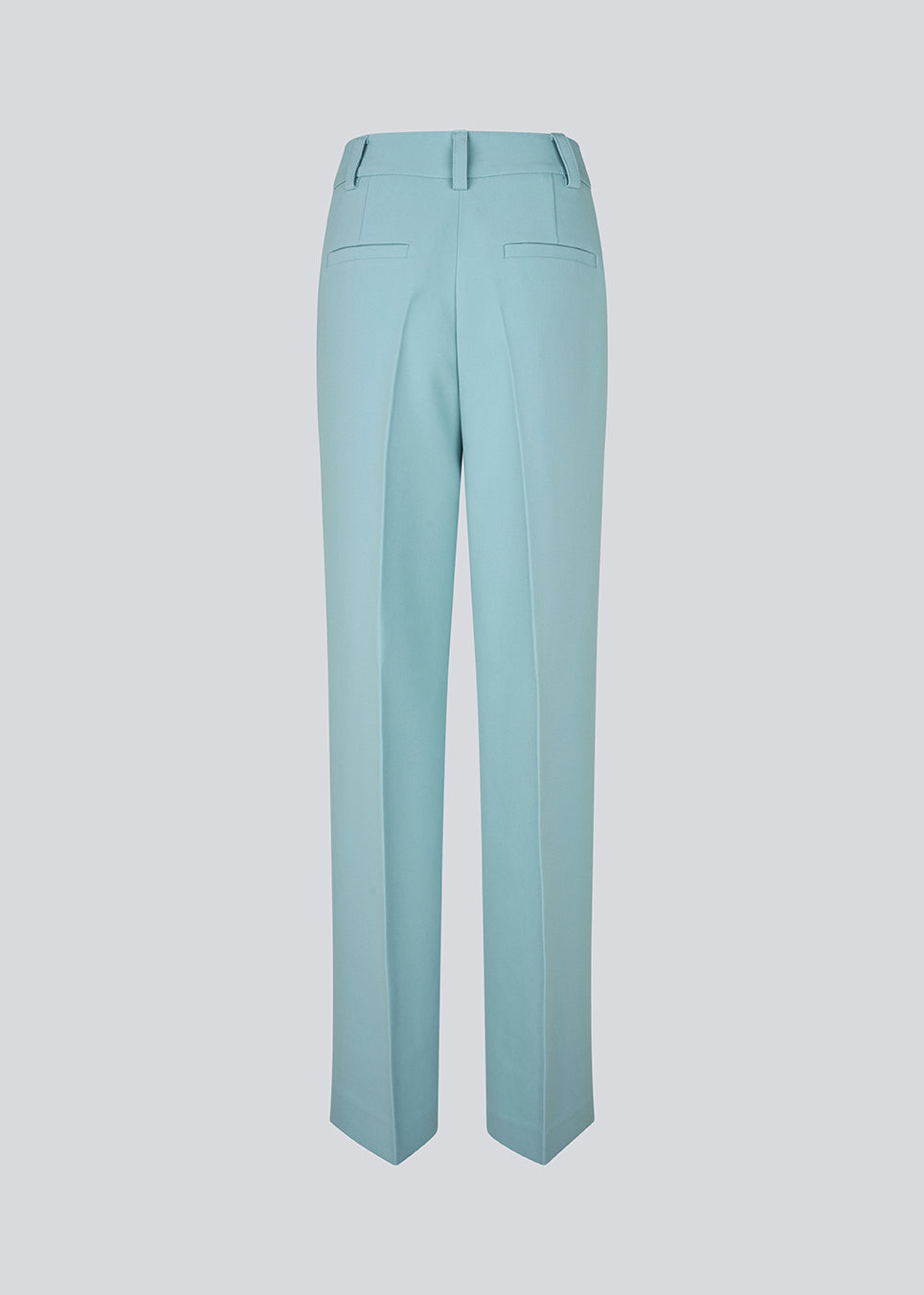 Gale pants i blå har et klassisk design. Buksen har lige, vide ben med pressefolder som skaber et elegant udtryk. Modellen er 175 cm og har en størrelse S/36 på.&nbsp;