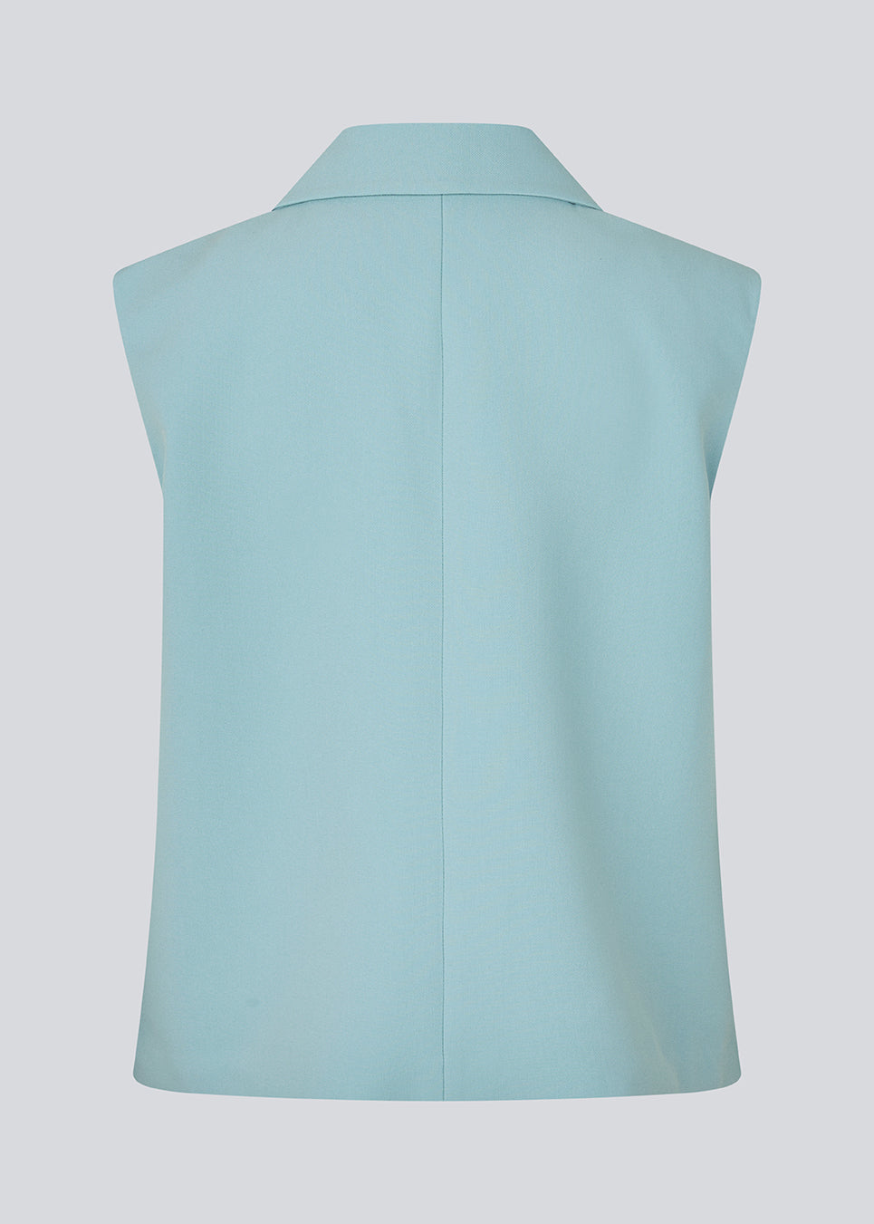 Løs habit vest i blå med krave i vores klassiske gale materiale. Galemd vest er ærmeløs og har en knappelukning fortil. Modellen er 175 cm og har en str. S/36 på.