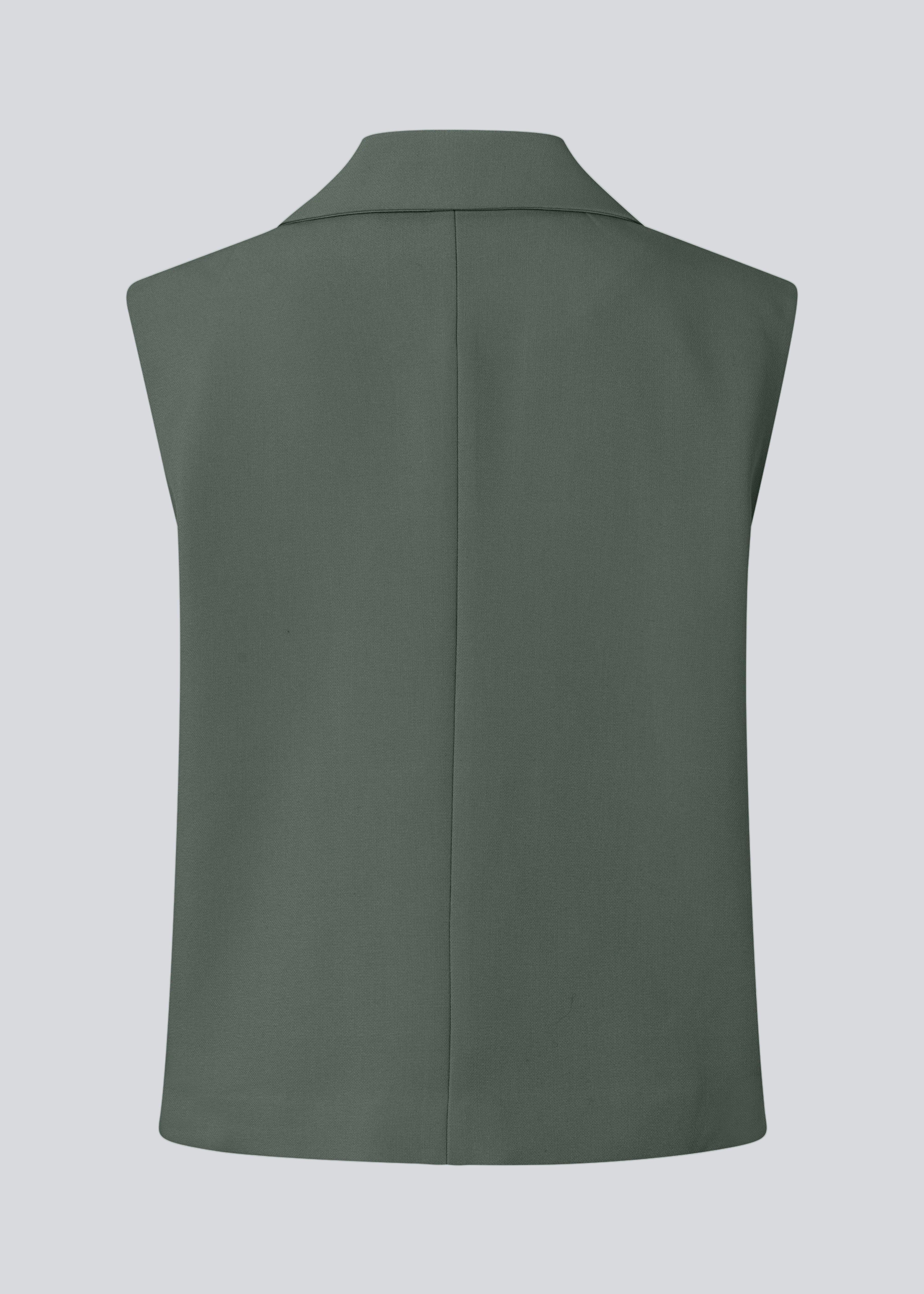 Løs vest i mørkegrøn med krave i vores klassiske gale materiale. Galemd vest er ærmeløs og har en knappelukning fortil.&nbsp;