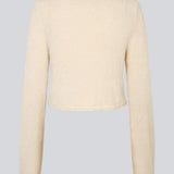 Cropped cardigan i fluffy materiale. HamptonMD cardigan har lange ærmer, v-halsudskæring og lukkes med to knapper fortil.