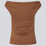 Off-shoulder top i et elastisk materiale. HimaMD off-shoulder top har en tætsiddende pasform og er let cropped.