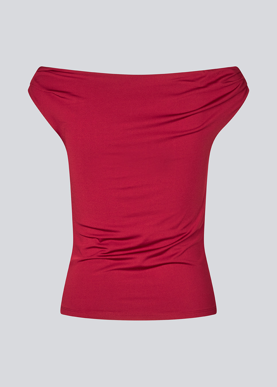 Off-shoulder top i et elastisk materiale. HimaMD off-shoulder top har en tætsiddende pasform og er let cropped.