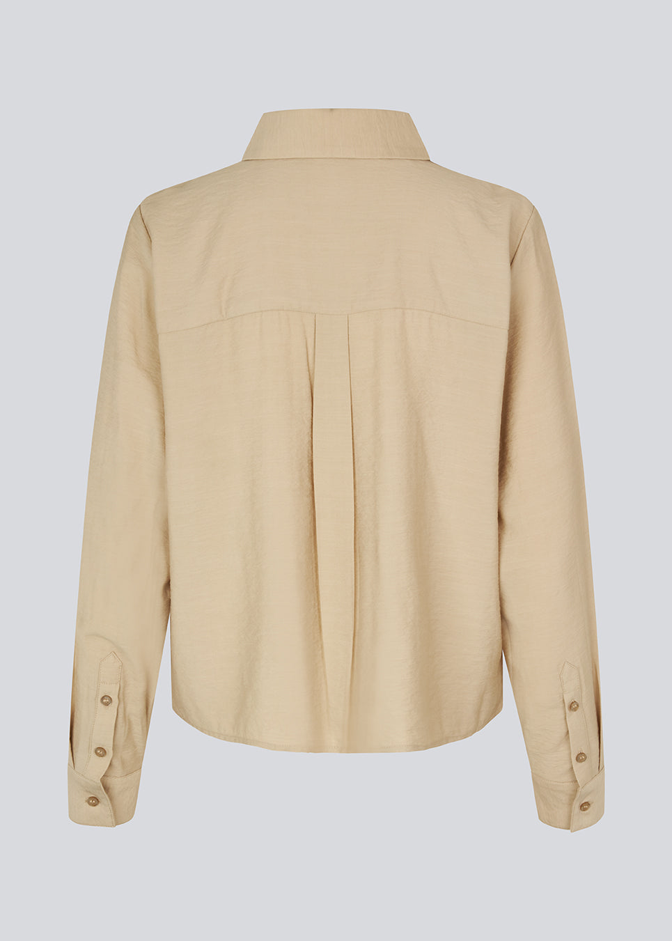 Skjorte i beige i en let EcoVero viskose med løs pasform. HudgesMD shirt har krave og knaplukning fortil og lange ærmer med manchet.&nbsp;