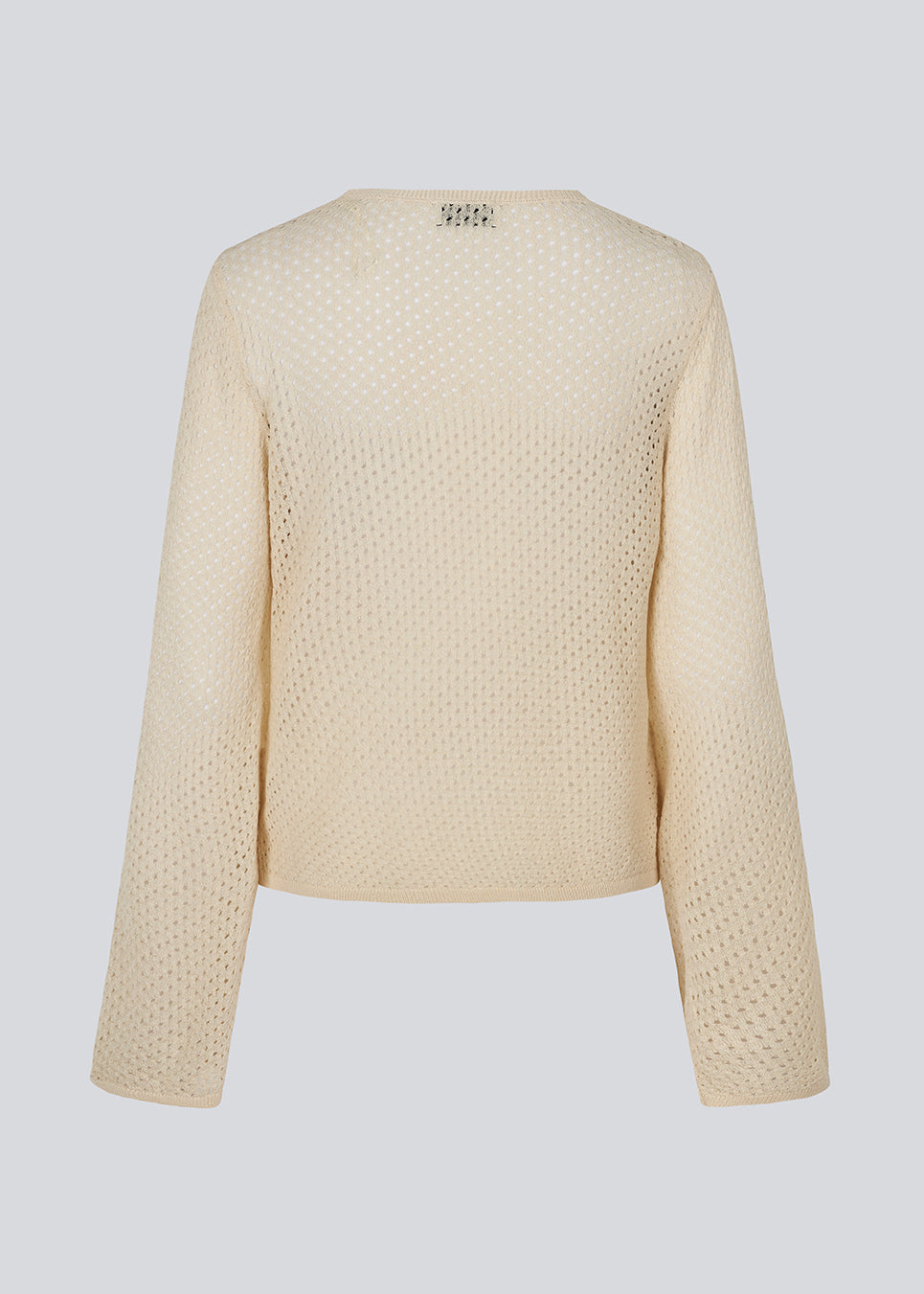 Langærmet beige bluse i løs pasform. IggyMD top er i et strikket materiale som er let gennemsigtigt.