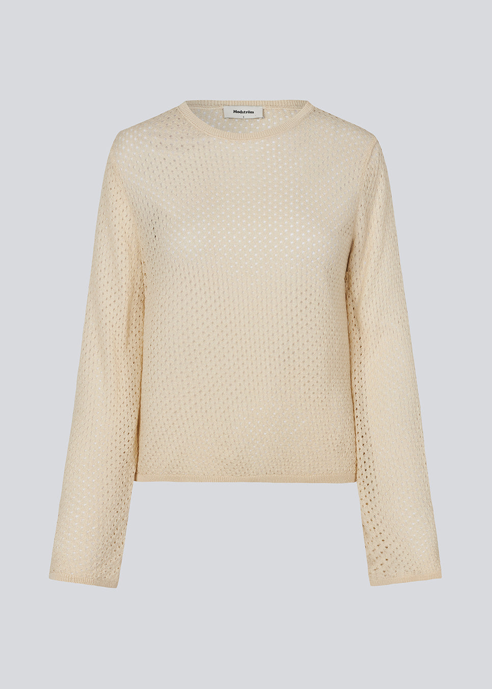 Langærmet beige bluse i løs pasform. IggyMD top er i et strikket materiale som er let gennemsigtigt.