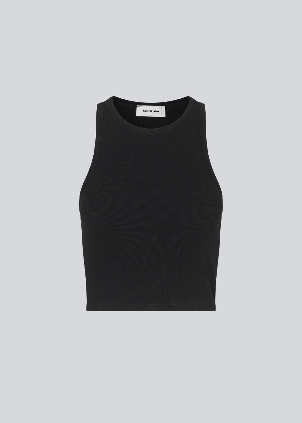 Lækker basic top i sort i en blød bomuldsrib. IgorMD crop top har en tætsiddende, cropped pasform med bryderryg og er perfekt at style til et sporty look. Modellen er 173 cm og har en størrelse S/36 på