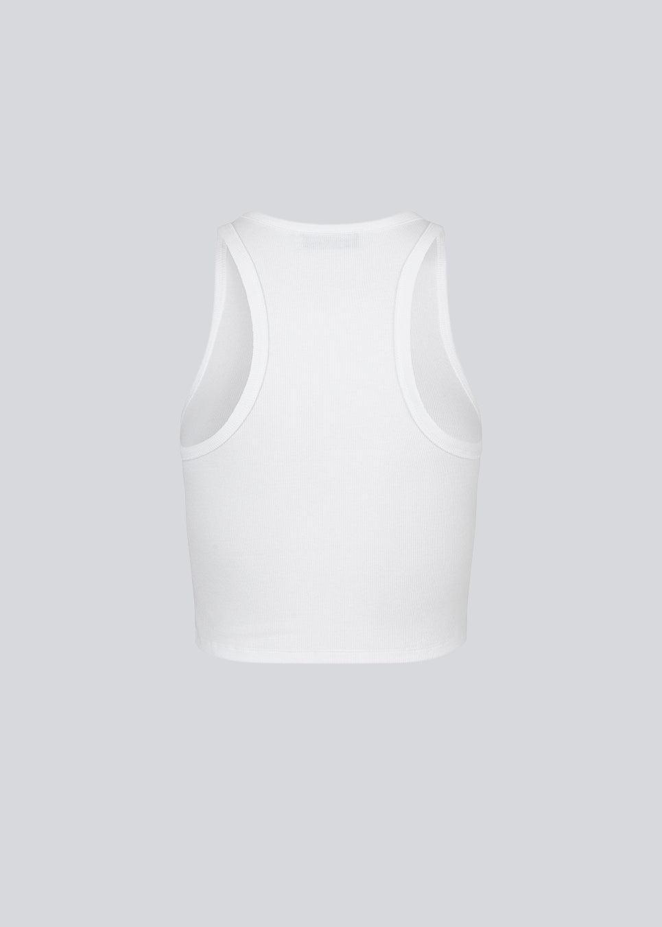 Lækker basic top i en blød bomuldsrib. IgorMD crop top har en tætsiddende, cropped pasform med bryderryg og er perfekt at style til et sporty look. Modellen er 173 cm og har en størrelse S/36 på
