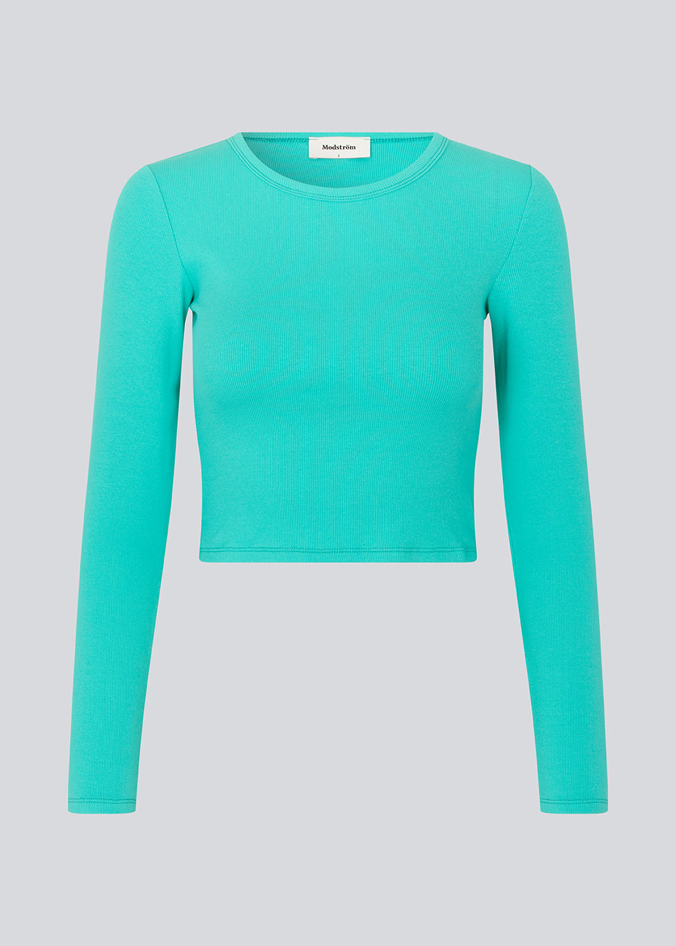 Lækker basic crop top i farven atlantis i en blød bomuldsrib med stretch. IgorMD LS crop top har en tætsiddende, cropped pasform med lange ærmer.  Modellen er 177 cm og har en størrelse S/36 på.