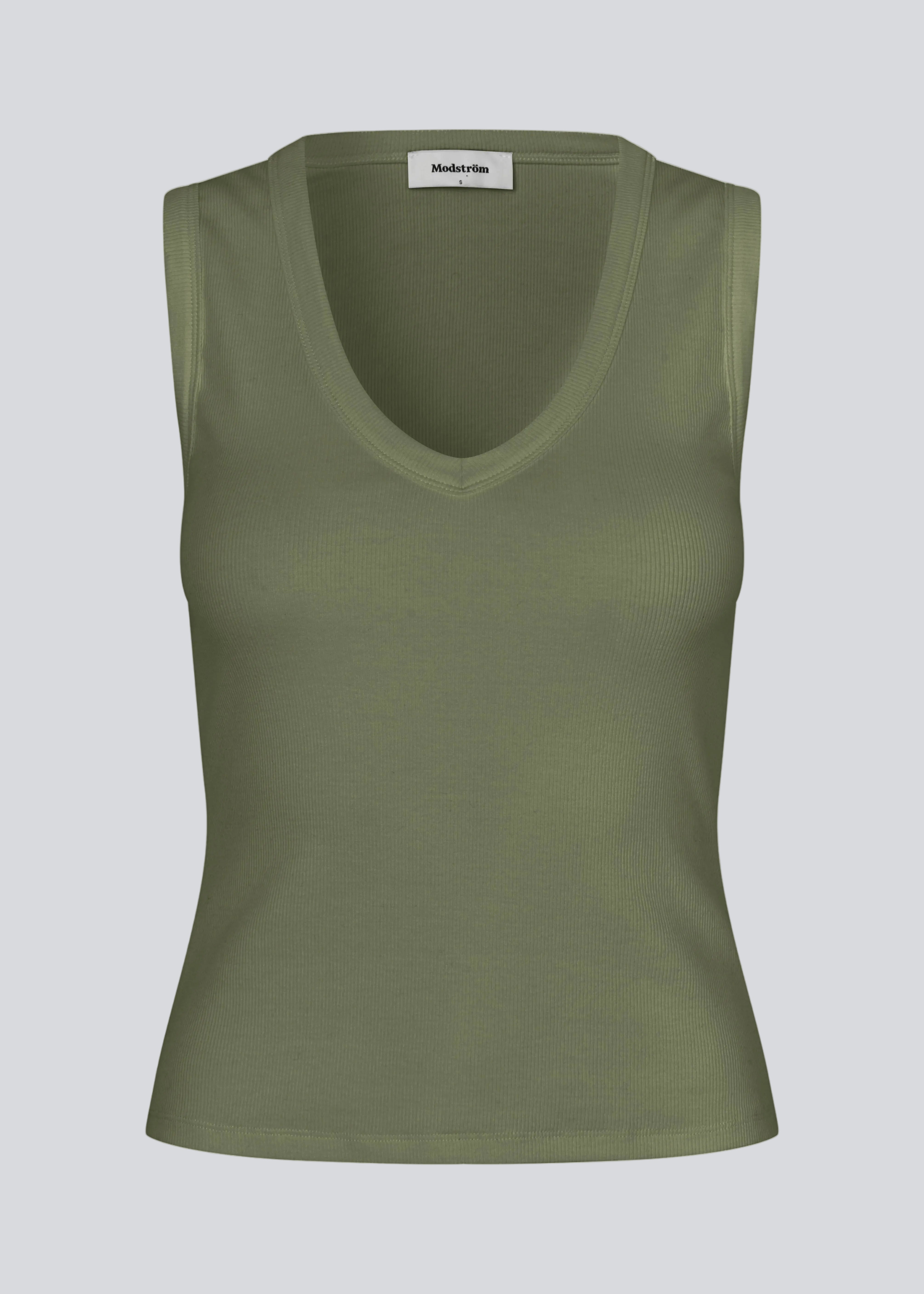 Ærmeløs grøn top i ribbed bomuldsjersey. Igormd tank top har en tætsiddende pasform og en rund halsudskæring. cropped pasform med lange ærmer.