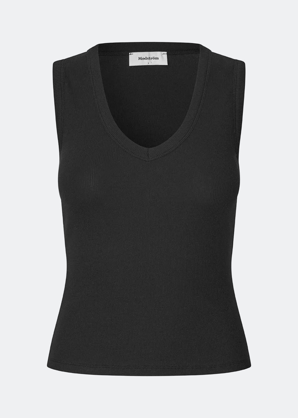 Ærmeløs top i ribbed bomuldsjersey. Igormd tank top har en tætsiddende pasform og en rund halsudskæring. cropped pasform med lange ærmer. Modellen er 175 cm og har en str S/36 på.