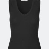 Ærmeløs top i ribbed bomuldsjersey. Igormd tank top har en tætsiddende pasform og en rund halsudskæring. cropped pasform med lange ærmer. Modellen er 175 cm og har en str S/36 på.