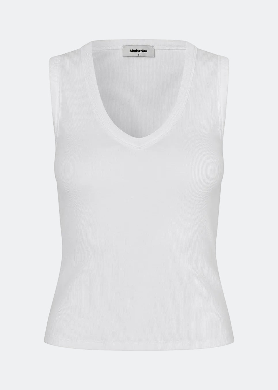 Ærmeløs top i ribbed bomuldsjersey. Igormd tank top har en tætsiddende pasform og en rund halsudskæring. cropped pasform med lange ærmer. Modellen er 175 cm og har en str S/36 på.