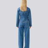 Figursyet skjorte i denim. IsoldeMD solid shirt har krave, løse ærmer og knappelukning fortil. 