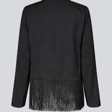 Langærmet sort top i twill med frynsedetalje. KylerMD shirt har en V-udskæring og løse ærmer.
