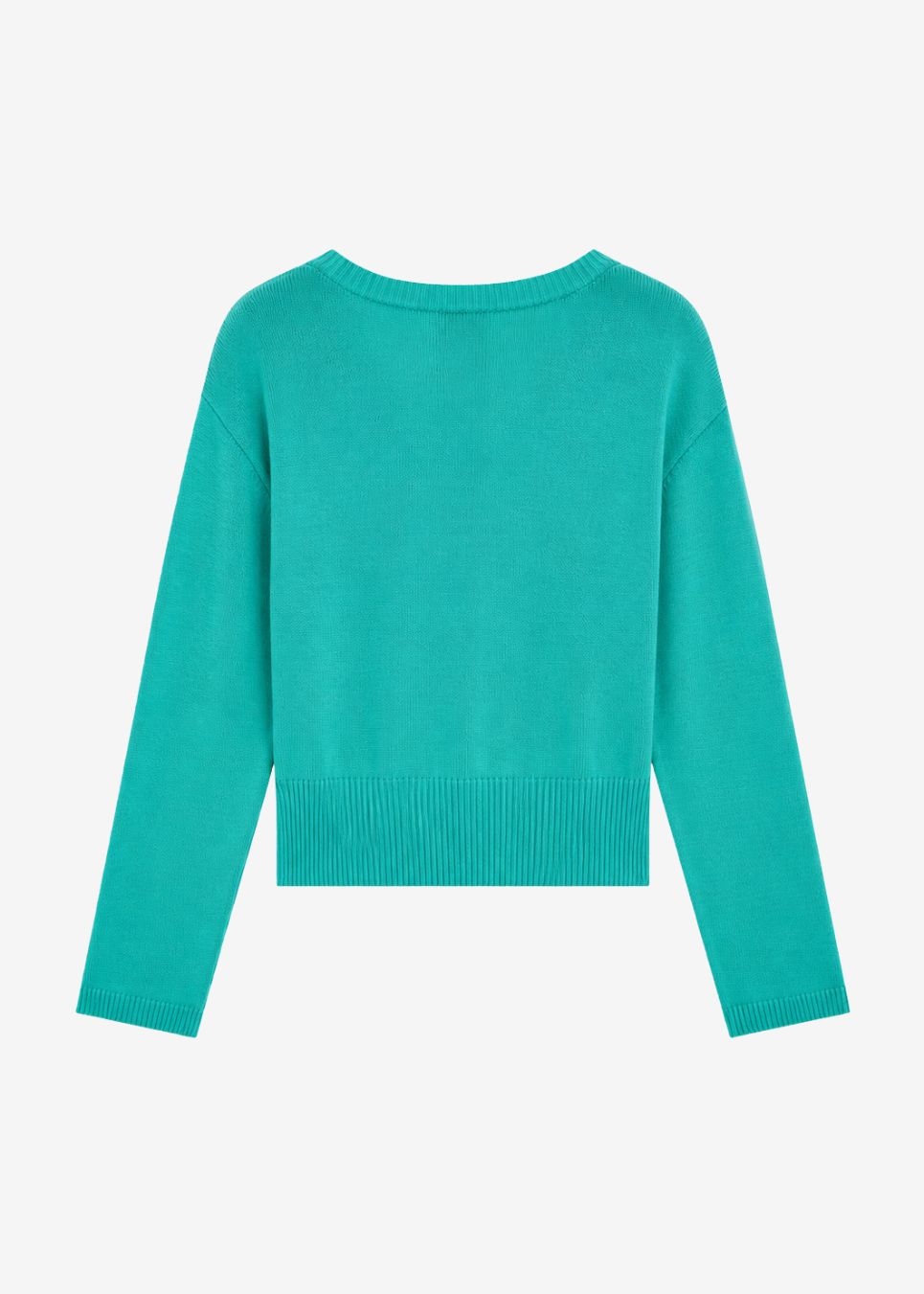 Kort strik med V-udskæring og lange ærmer. Malvamd v-neck er skabt i bomuld og afsluttet med ribkanter ved halsen, manchetterne og forneden. Brug den med højtaljede bukser eller en let nederdel.