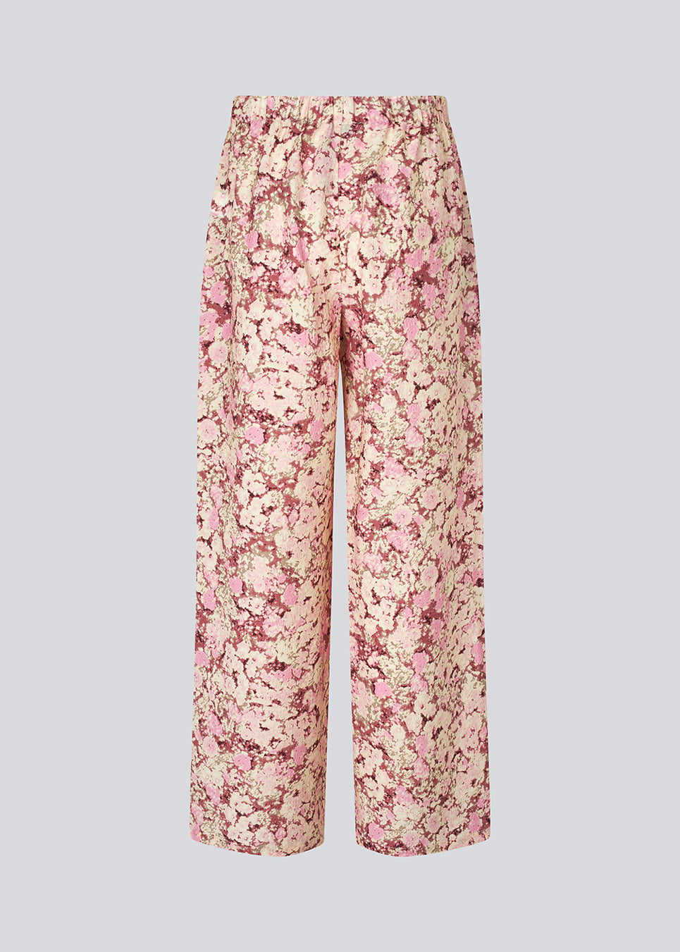 Løse bukser med brede ben. MeliaMD print dress har sidelommer og et elastik i taljen.