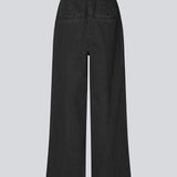 Habitbukser i denim med vide ben. MinniMD pants har en mellemhøj talje, lynlåsgylp og læg foroven, samt sidelommer og paspolerede baglommer.