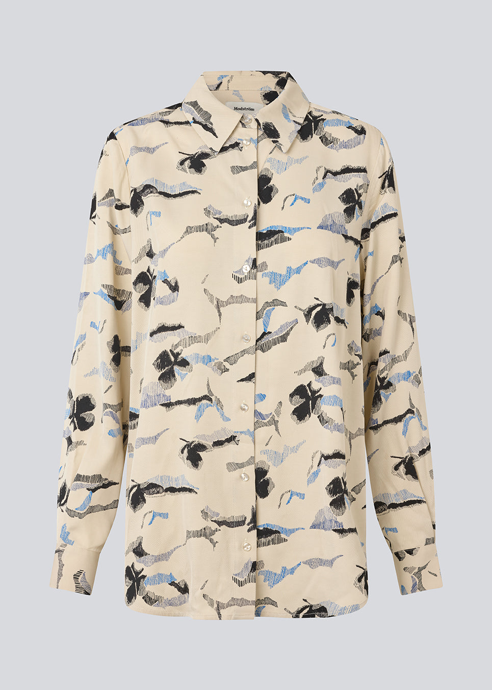 Klassisk skjorte med løs pasform. MistMD print shirt har lange ærmer, skjorte krave og en klappelukning fortil.