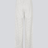 Hvide bukser med vide ben i broderie angalise. NanetteMD pants har en elastisk talje og foer.
