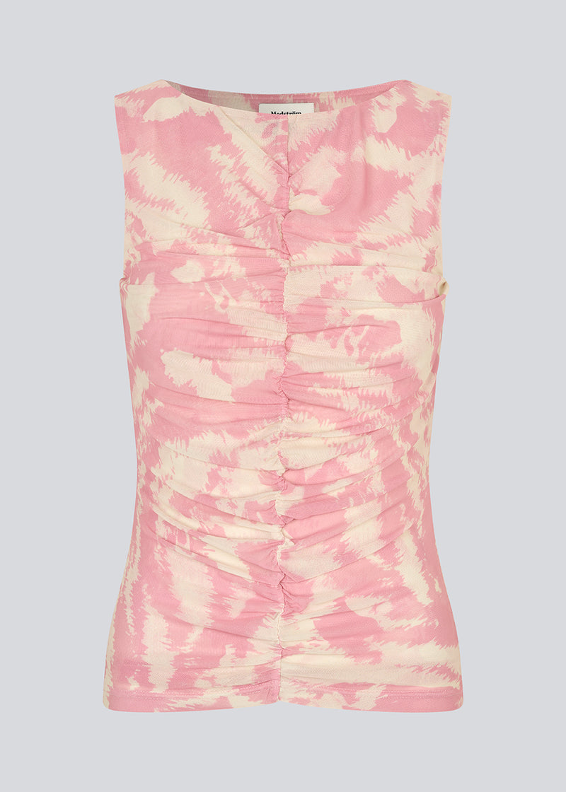 Ærmeløs top i et elastisk materiale. NimraMD print top har en rund hals og en rynkedetalje fortil.